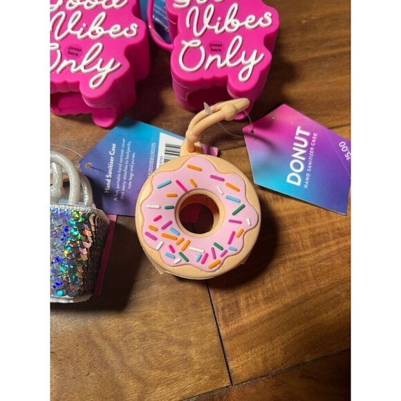 Lot of 6 hand sanitizer cases.  Good vibes, hat, bag, donut, melon - Picture 3 of 6
